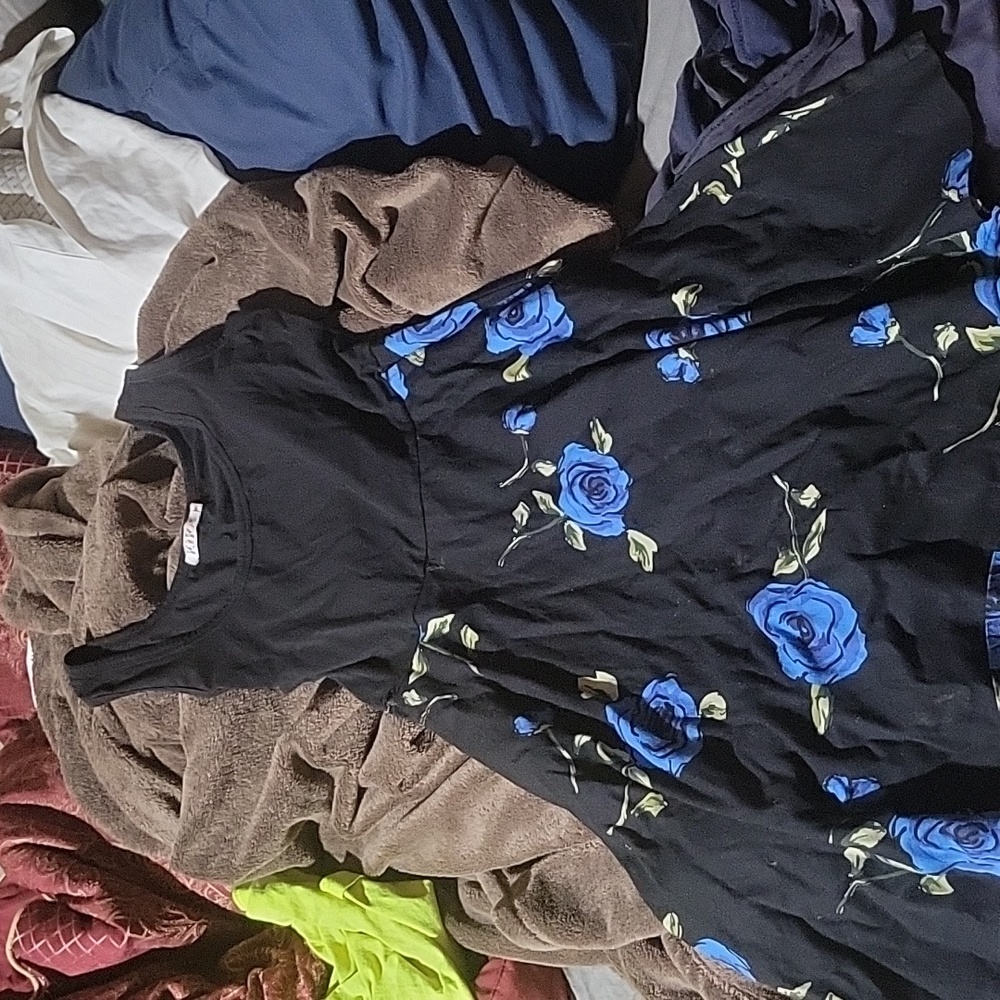 A black tank top dress with blue roses